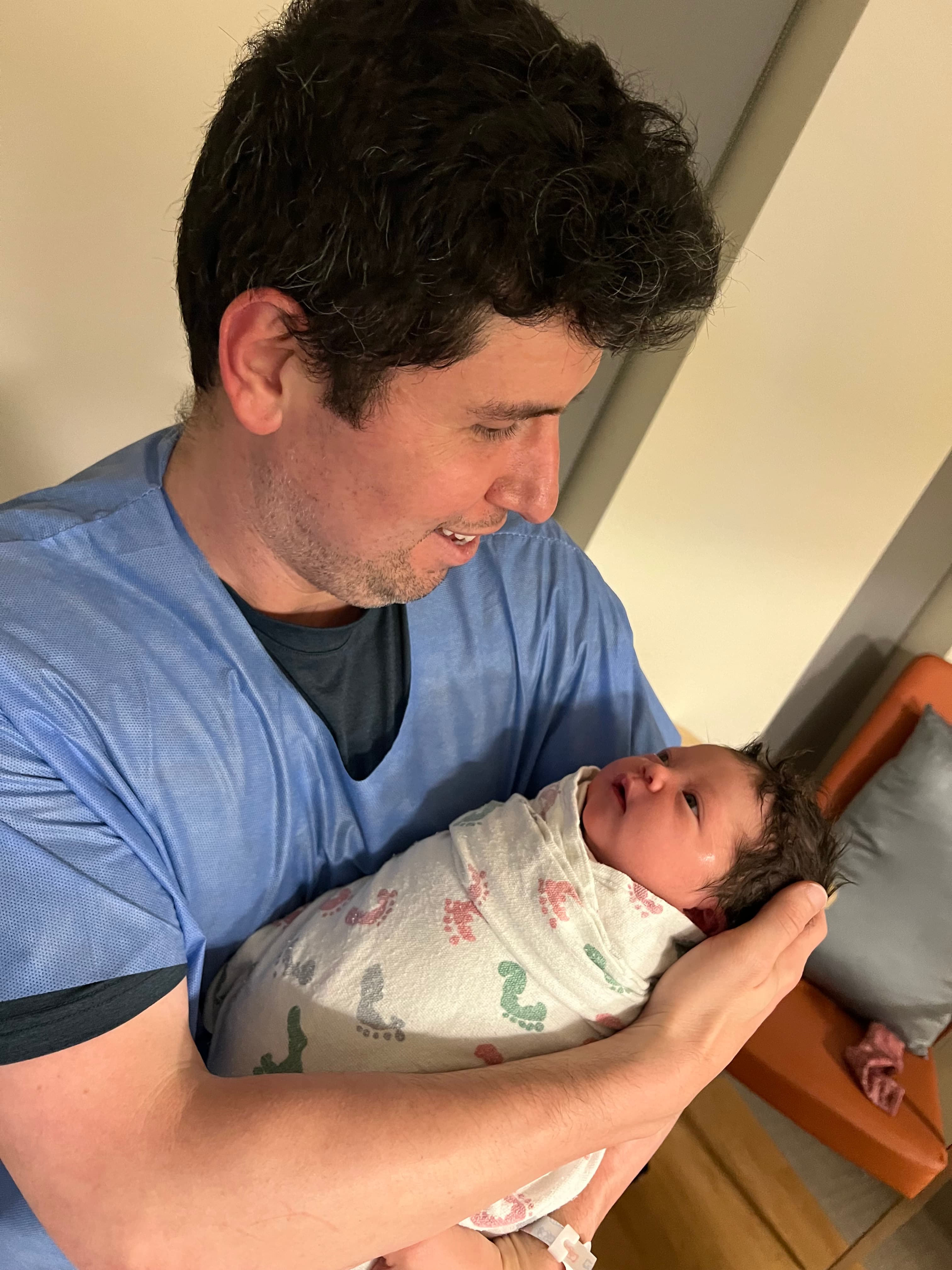 Holding my newborn daughter Lumen on day one in the hospital